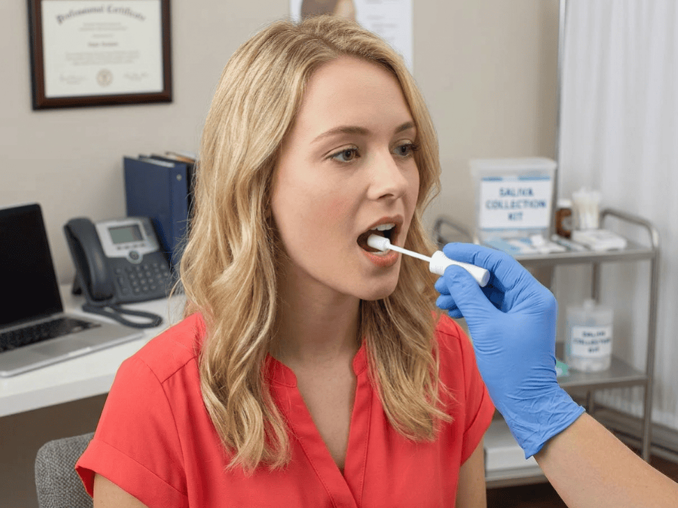 Person receiving a mouth swab test in an office setting